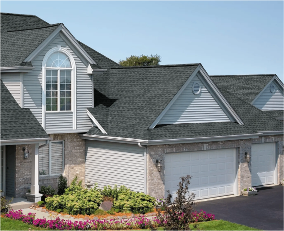 A modern suburban house with a double garage and arched windows.